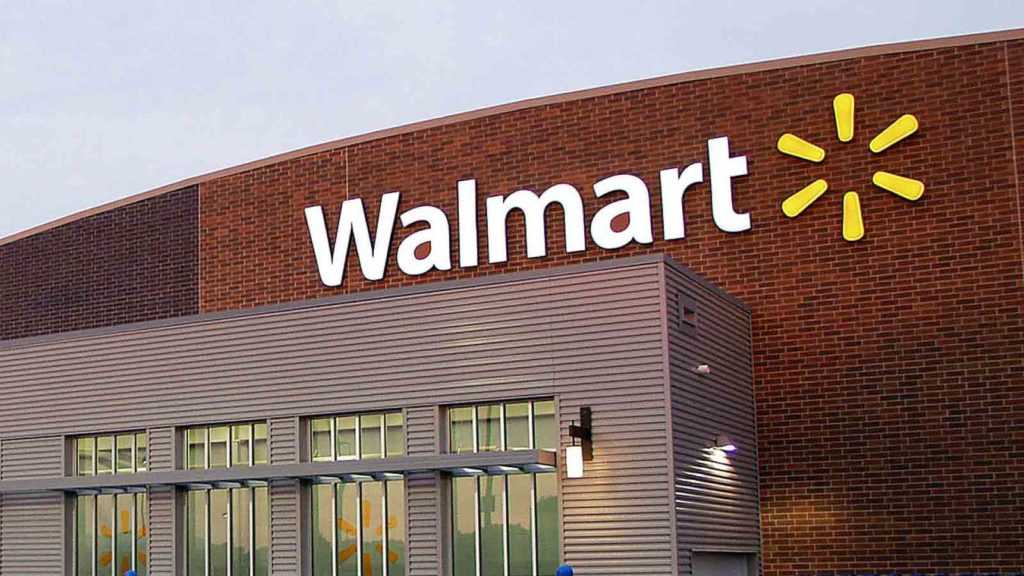 A Walmart storefront with brick walls.